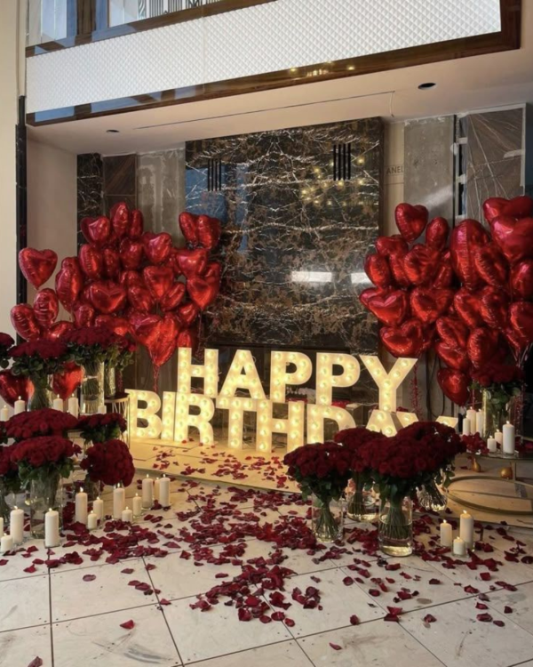 Balloons with Room Full of Roses