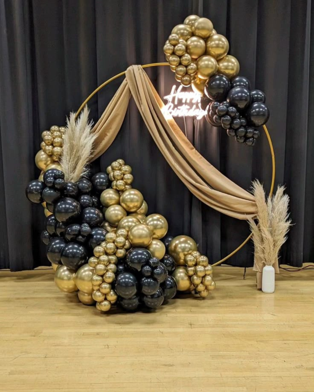 Black and gold star balloons Arch