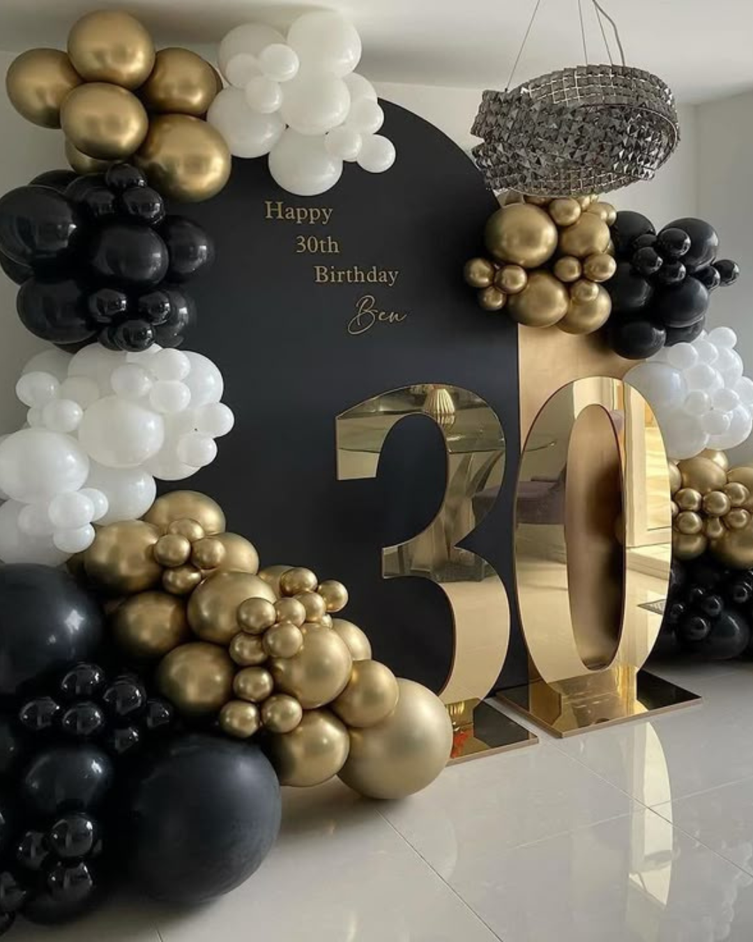 Gold black and white balloon arch