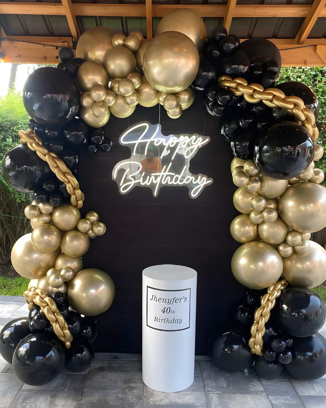 gold and black arch and stands decoration
